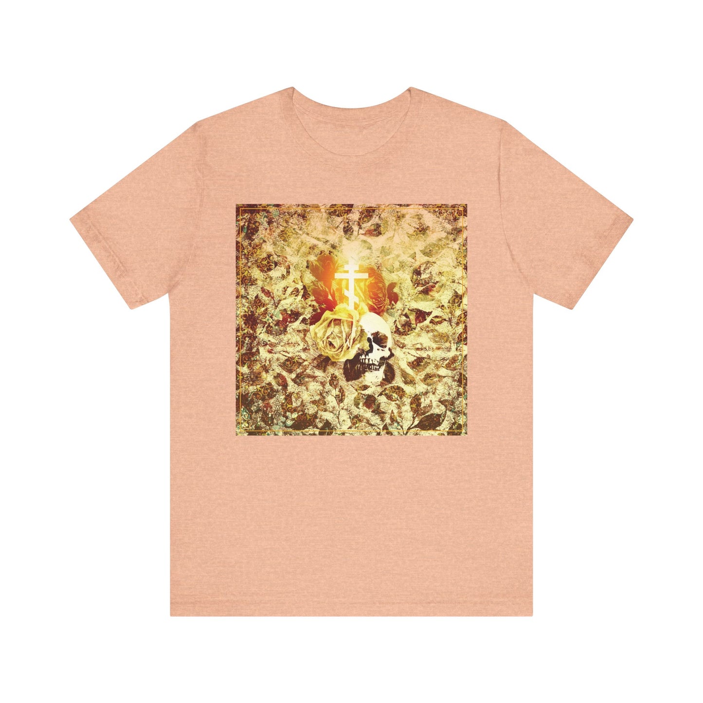 The Heather Peach Rose & Skull Glowing Orthodox Cross tee features a gothic Christian aesthetic with a gold-leaf, rose, and skull graphic centered by a glowing cross—symbolizing renewal and inspired by Ezekiel's prophecy.