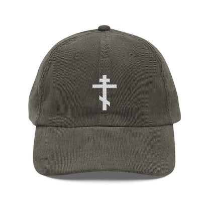 Olive cotton corduroy cap featuring a simple white Orthodox TriBar Cross—weapon of unseen warfare that makes demons tremble—embroidered on the front.