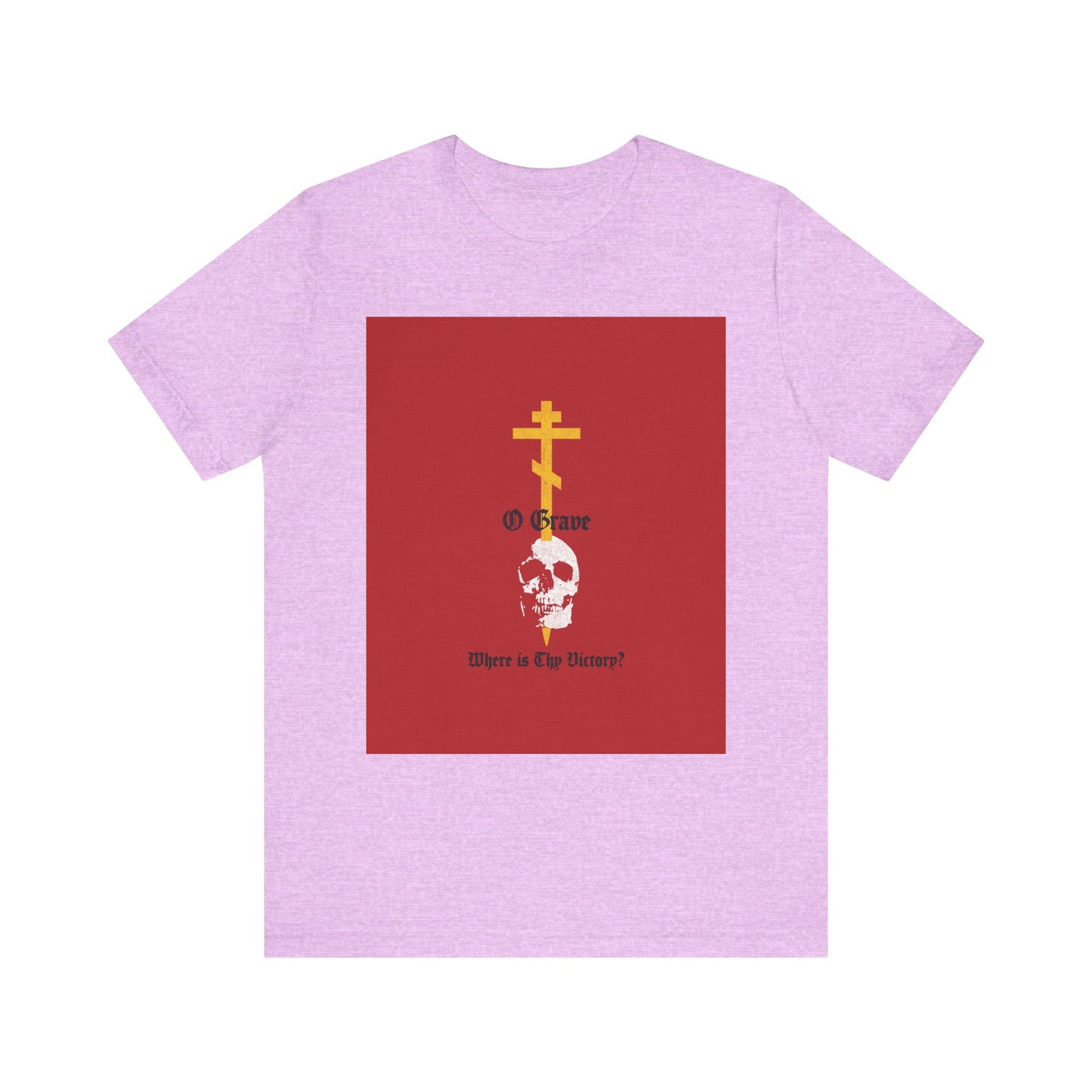 Heather Prism Lilac t-shirt featuring a gold Orthodox cross piercing a skull with text: "O Grave, Where Is Thy Victory? 1 Cor 15:55"—a bold Christian statement of resurrection and salvation.