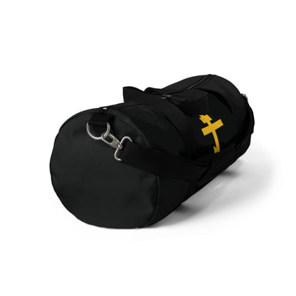 Black gym duffel bag featuring a yellow Orthodox cross on a black background, inspired by Galatians 2:20—"crucified with Christ." Precious and life-giving weapon of unseen warfare for Orthodox Christians. Shown on white.