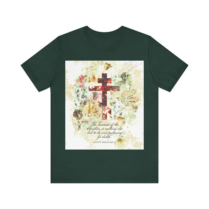 Forest green t-shirt with a white and beige floral scrapbook-style cross, inspired by arts & crafts and St Irenaeus, reflecting Orthodox Christian themes; “Preparing For Death” design printed on the front.