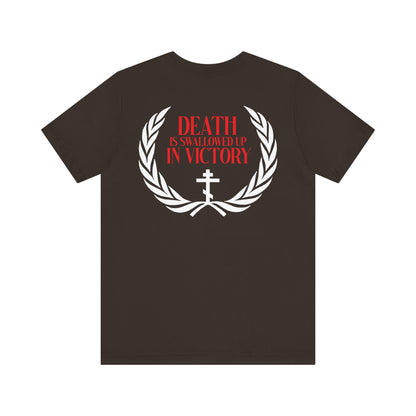 The "Archangel Michael of the Apocalypse Iconographic / Death is Swallowed Up In Victory" double-sided unisex t-shirt features a white laurel wreath, cross, and red “Death is swallowed up in victory” text, honoring Archangel Michael at Colossae.