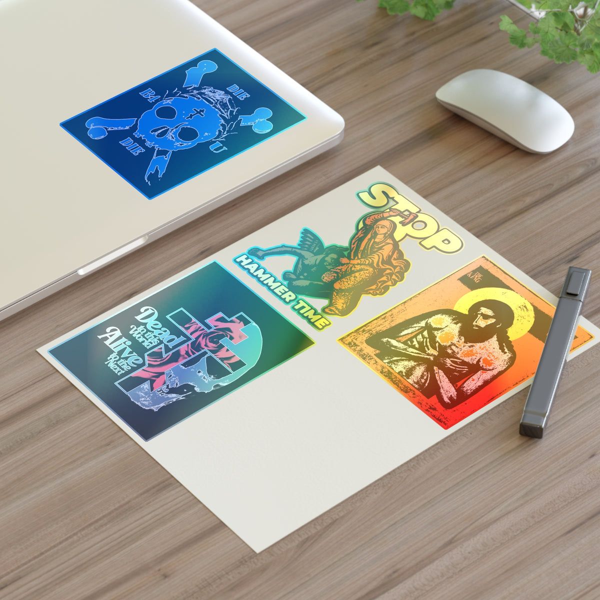 Four Random Mix No. 1 Four Sticker Sheet | Orthodox Stickers on a desk with a pen, mouse, plant, and laptop.