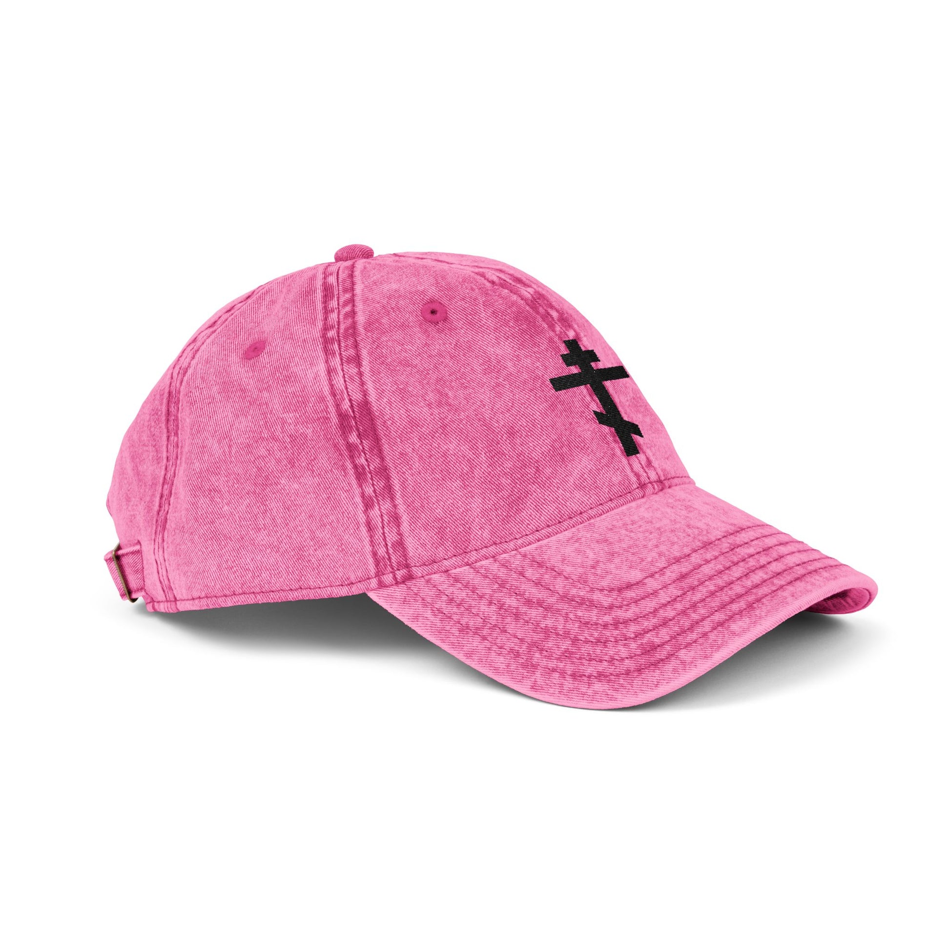 A pink denim cap featuring a simple black Orthodox TriBar Cross, inspired by St. John of Kronstadt’s faith. “Crucify My Ego to the Precious and Life Giving Cross” embroidered in a minimalist Christian style.