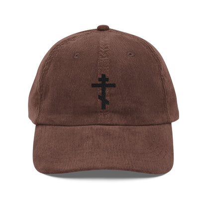 Simple black Orthodox TriBar Cross cap: brown corduroy baseball hat with embroidered double-barred cross on the front. Cotton, Orthodox Christian design. "Weapon of Unseen Warfare Which Makes Demons Tremble.