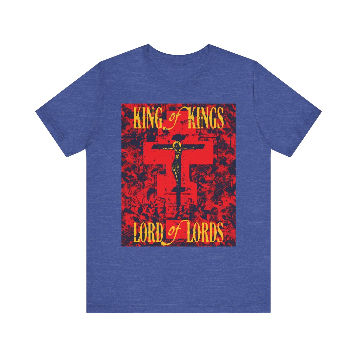 Heather true royal t-shirt featuring a red, Orthodox iconographic graphic of Christ crucified on the cross with bold yellow "King of Kings, Lord of Lords" lettering, inspired by the Word of God; made from lightweight cotton for a unisex fit and accented with a unique nature texture.