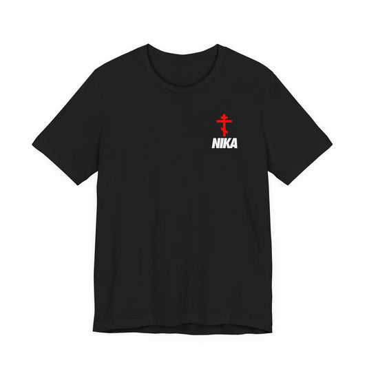 Black t-shirt with small Orthodox cross and bold NIKA text, inspired by the NIKE logo. Athletic ascetic fashion merges "Jesus Christ Conquers" symbolism with a modern Christian design.