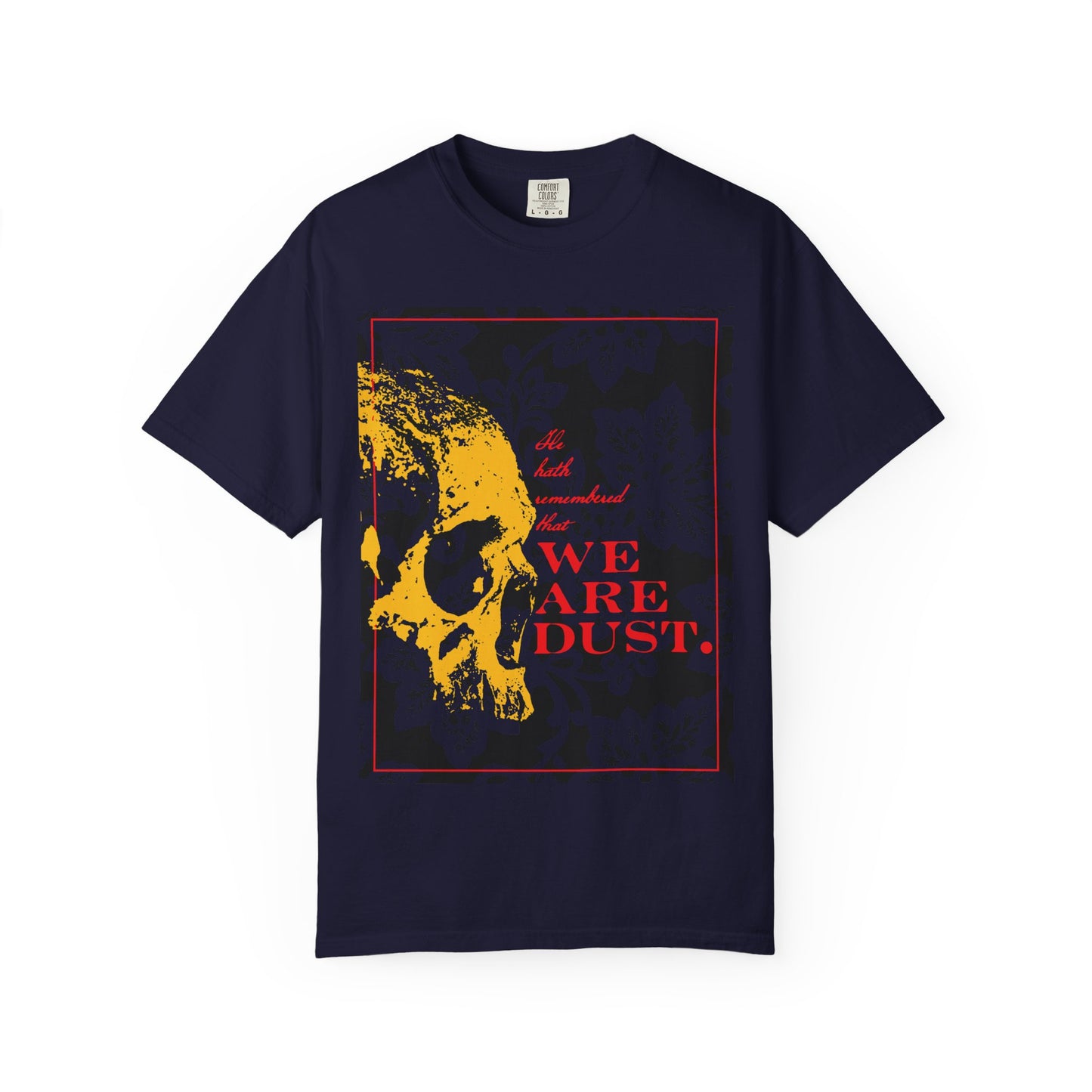 True Navy heavyweight cotton unisex t-shirt featuring a yellow skull on a blue floral background and bold red "We Are Dust" text—a Memento Mori design inspired by Psalm 102, reflecting the Lord’s compassion and mercy.