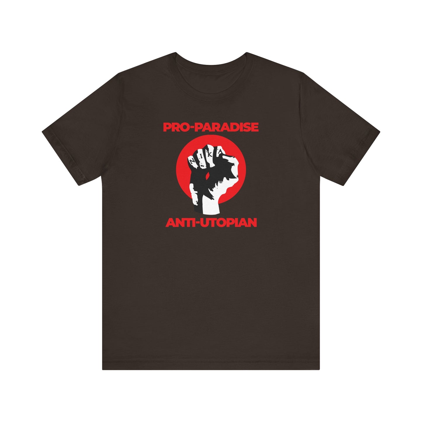 Brown lightweight unisex T-shirt featuring a NIKA fist graphic and "Pro-Paradise Anti-Utopian" text, inspired by Christ crucified and a call to resist the dominant secular paradigm.