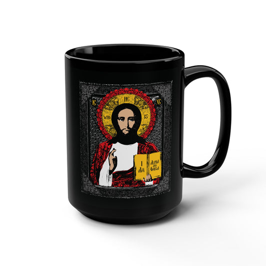 Black mug with Christ Pantocrator iconographic design, "He-Who-Is," featuring Jesus with a gold halo, inspired by "I Am the Alpha and Omega"—an Orthodox Christian icon-style graphic.