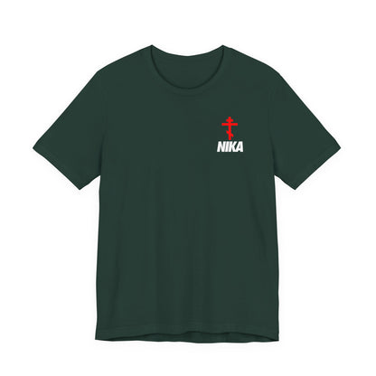 Forest-colored t-shirt featuring a small Orthodox cross with bold NIKA text—“Jesus Christ Conquers”—in white on the upper left chest. NIKE logo mashup; athletic ascetic style.