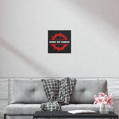 A living room with a gray sofa, plaid throw, pink flowers, and the "King of Kings Crown of Thorns | The King of Glory | Christ is King | Revelation 19:16" Christian Art Poster.