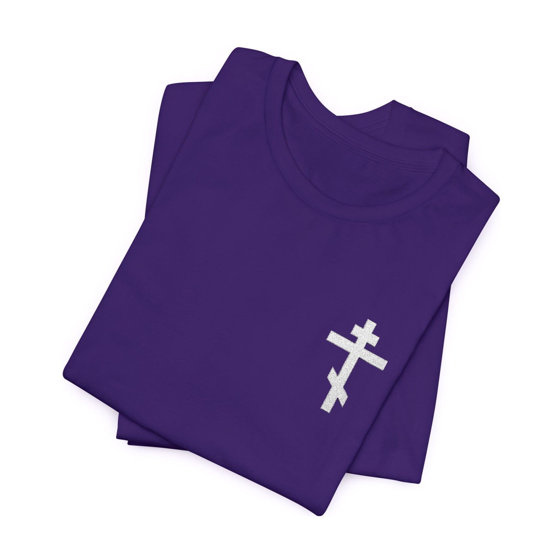 Small Embroidered Orthodox Cross (White) Christian T-Shirt, inspired by Galatians 6:14, featuring a white Orthodox cross design. Shown folded on a white background.