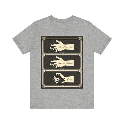 Athletic Heather t-shirt featuring earthtone Americana art: the crucified Christ’s hand in ornate frames with “I Know That My Redeemer Lives” (Job 19:25). A tribute to resurrection and enduring faith in Orthodox Christian tradition.