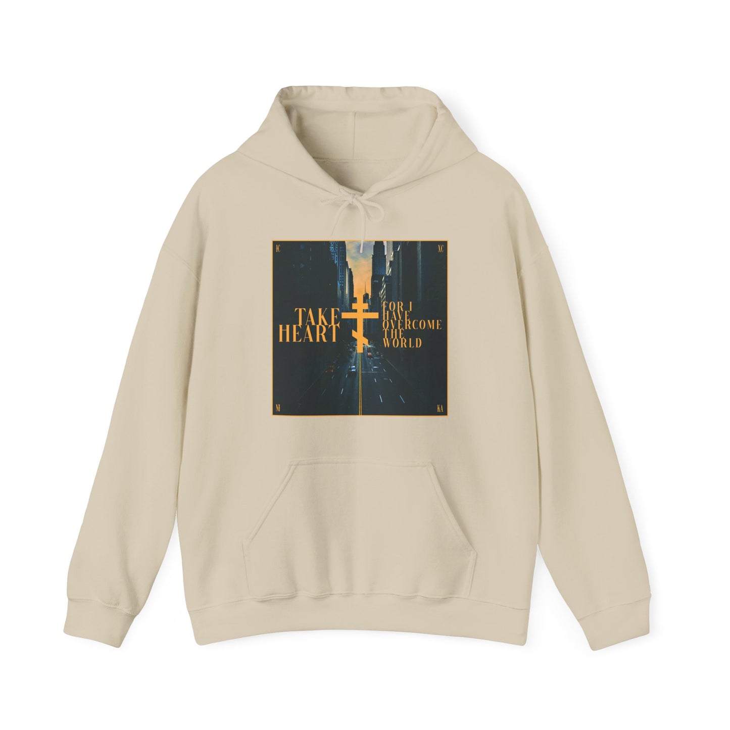 Sand-colored "Take Heart, For I Have Overcome the World" hoodie featuring a modern city street scene graphic and John 16:33—a stylish Orthodox Christian reminder of faith and strength.