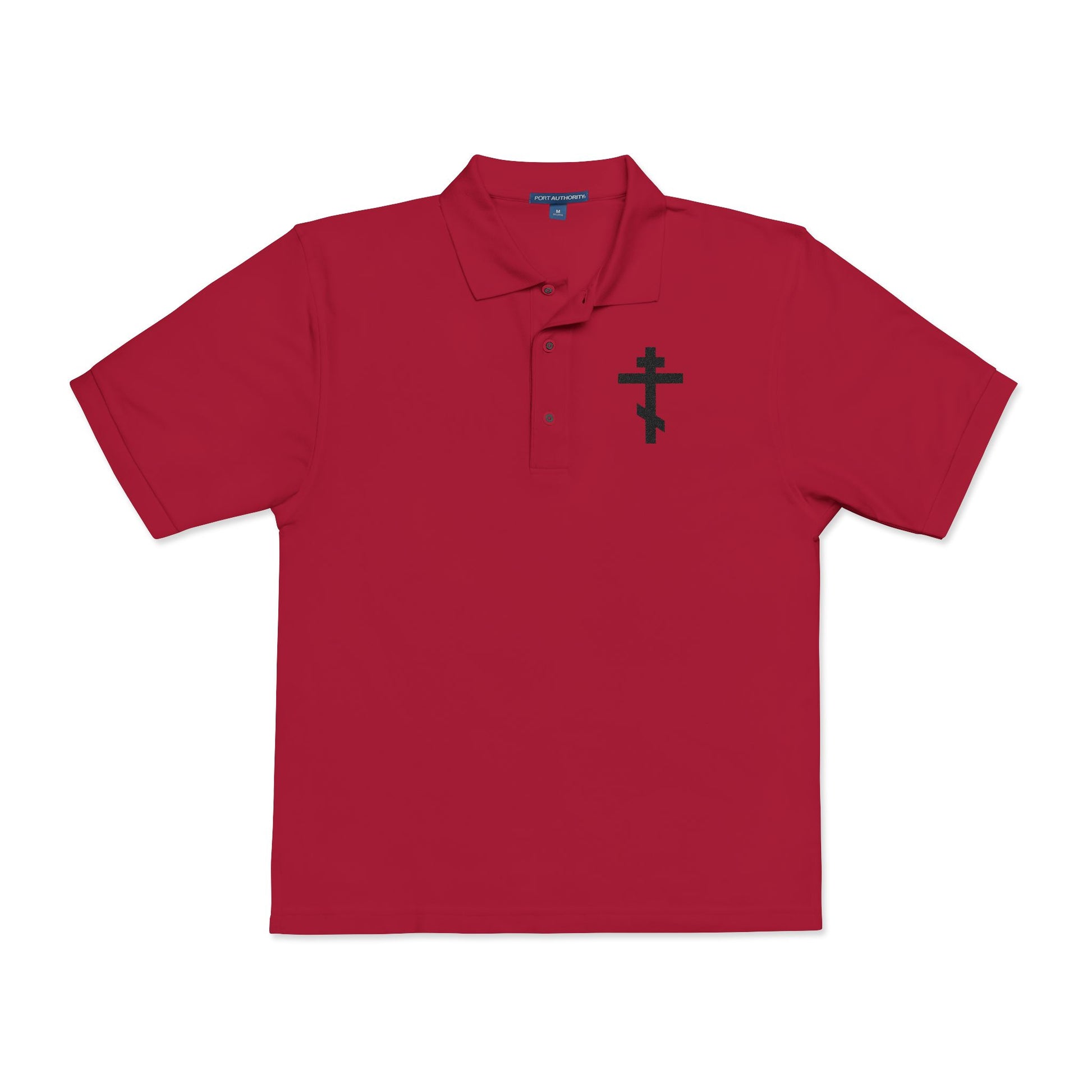 Red Christian polo shirt featuring an embroidered black Orthodox cross on the left chest, inspired by Gal 6:14: "May I never boast, except in the cross of our Lord Jesus Christ.