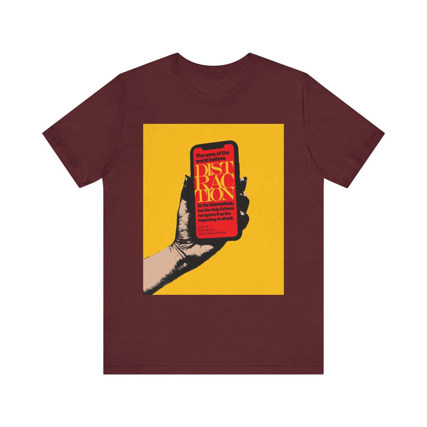 Maroon "Distraction is the Beginning of All Evil" tee—Orthodox Christian unisex shirt featuring a hand holding a phone, with bold yellow and red The Field-inspired text on a vibrant yellow background.