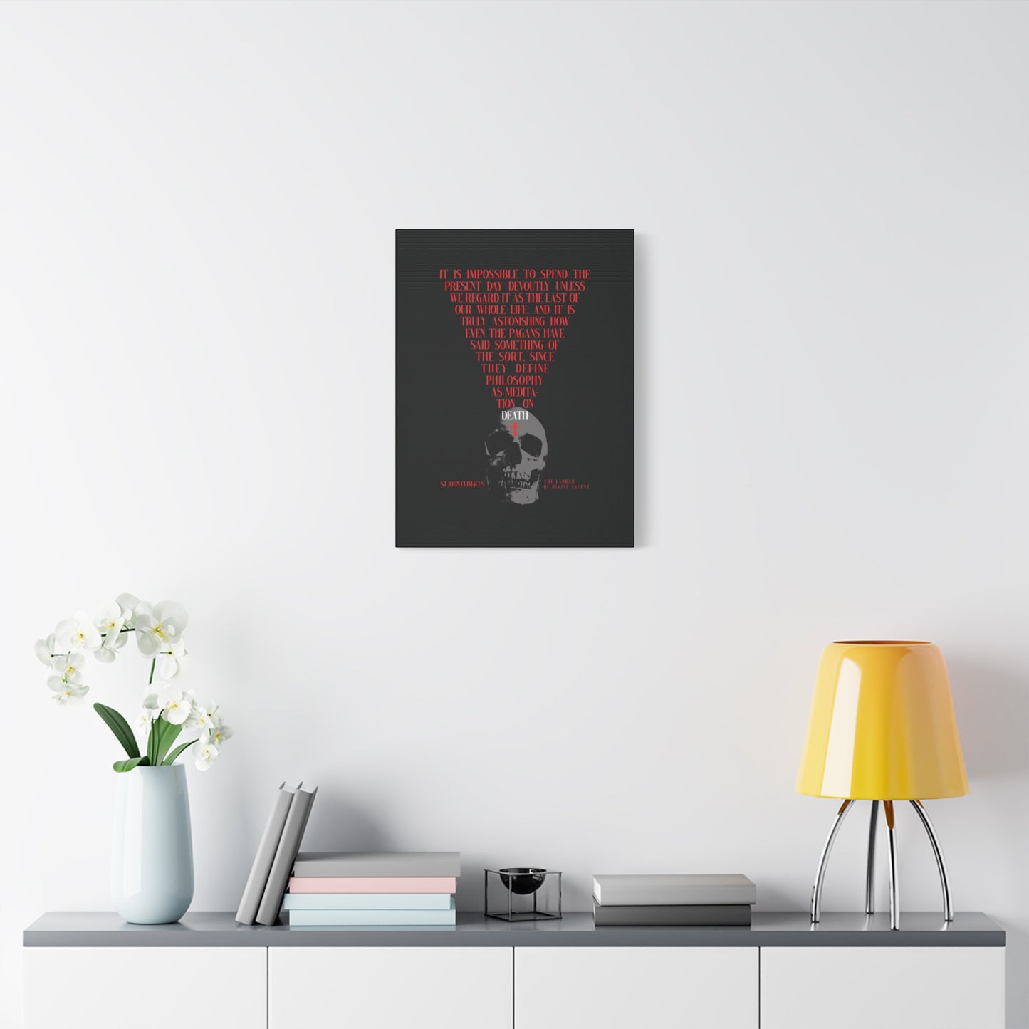 A modern room with The Present Day As the Last Day of Our Life canvas—featuring a skull and red Orthodox cross—evokes St John Climacus’s memento mori, a reminder from Orthodox tradition to reflect on life’s fleeting beauty.