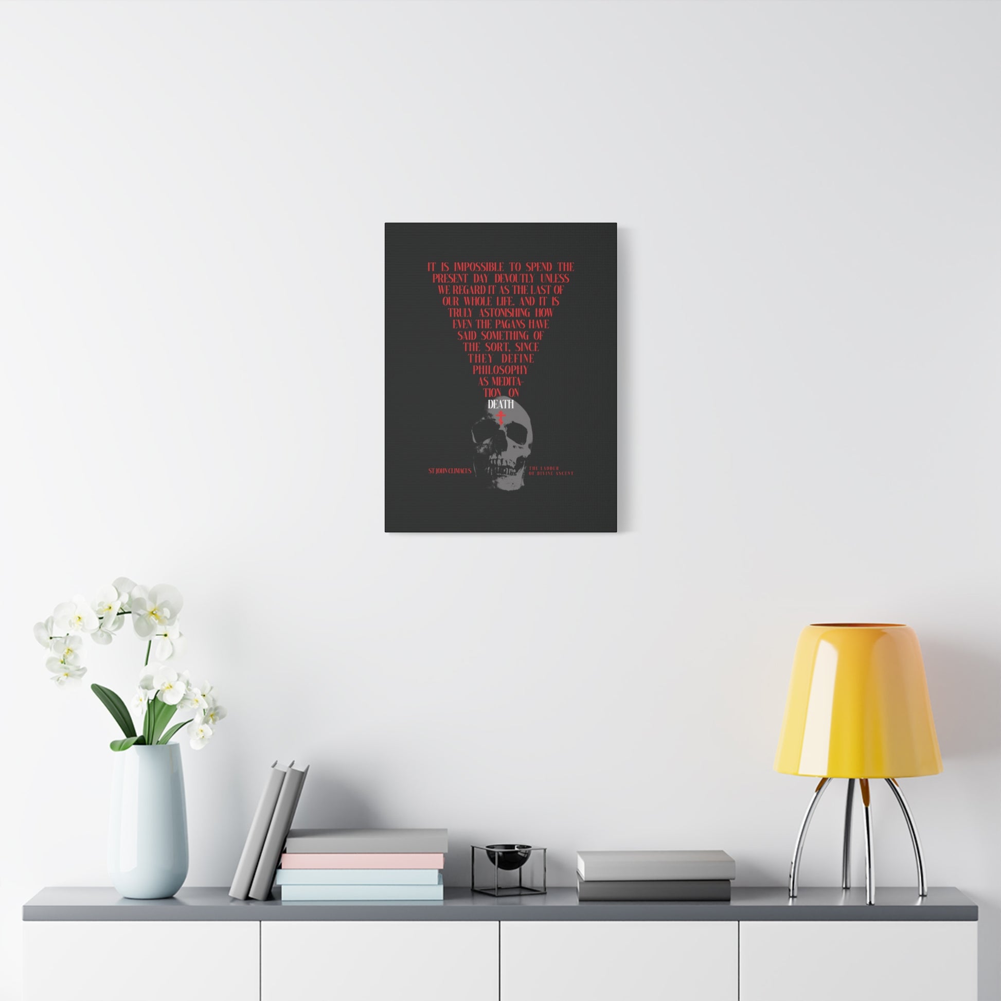 A modern room with The Present Day As the Last Day of Our Life canvas—featuring a skull and red Orthodox cross—evokes St John Climacus’s memento mori, a reminder from Orthodox tradition to reflect on life’s fleeting beauty.