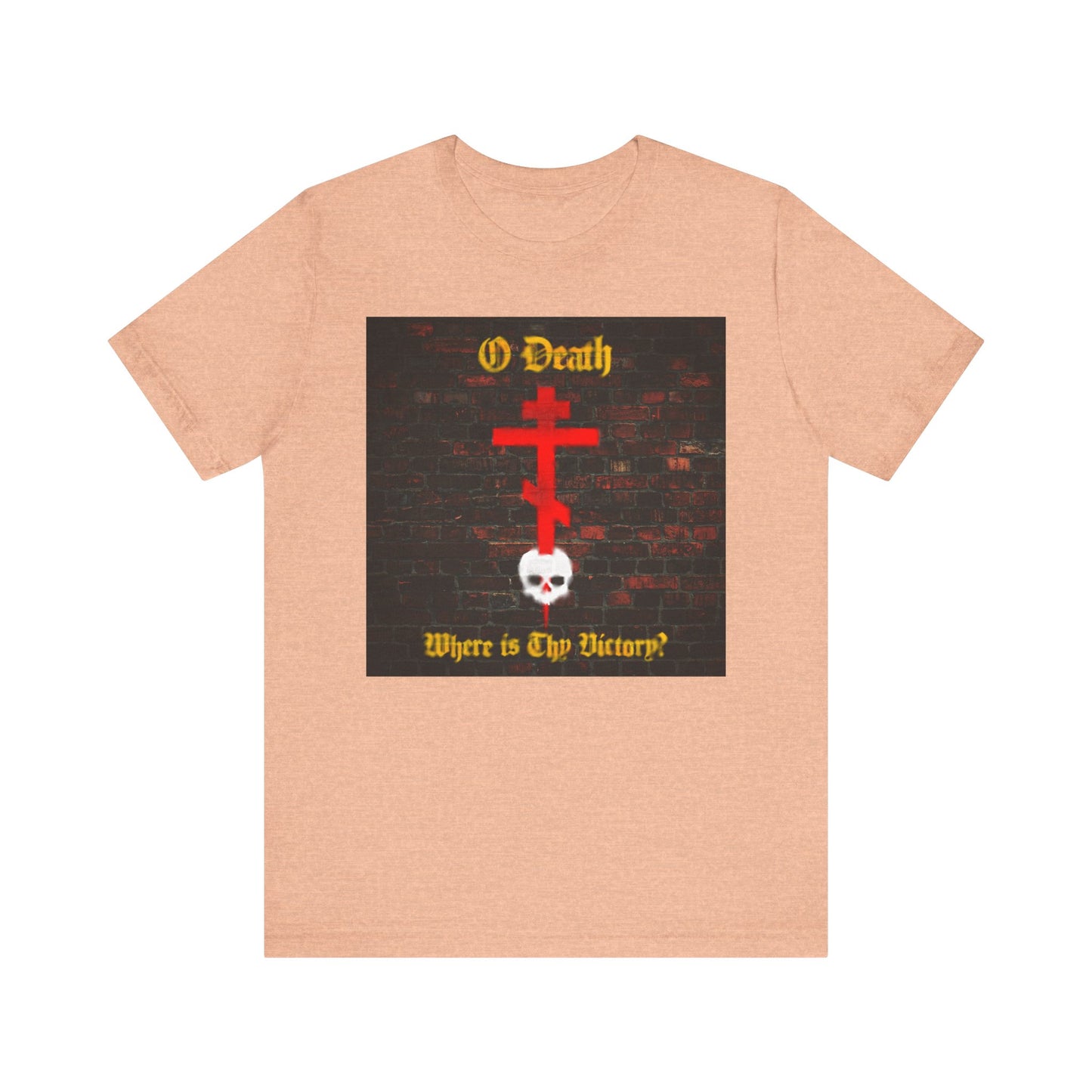 Heather peach t-shirt featuring a red Orthodox cross stabbing a white skull with the text, "O Death, Where is Thy Victory?"—inspired by St Cyril of Jerusalem—displayed in a brick wall graffiti aesthetic and reflecting on the sting of death overcome through Baptism.