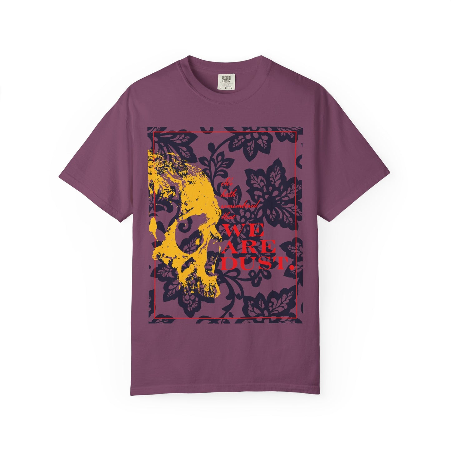 Berry heavyweight cotton unisex T-shirt featuring a yellow skull on a blue floral background with bold red "WE ARE DUST" text, inspired by the compassion reflected in Psalm 102.