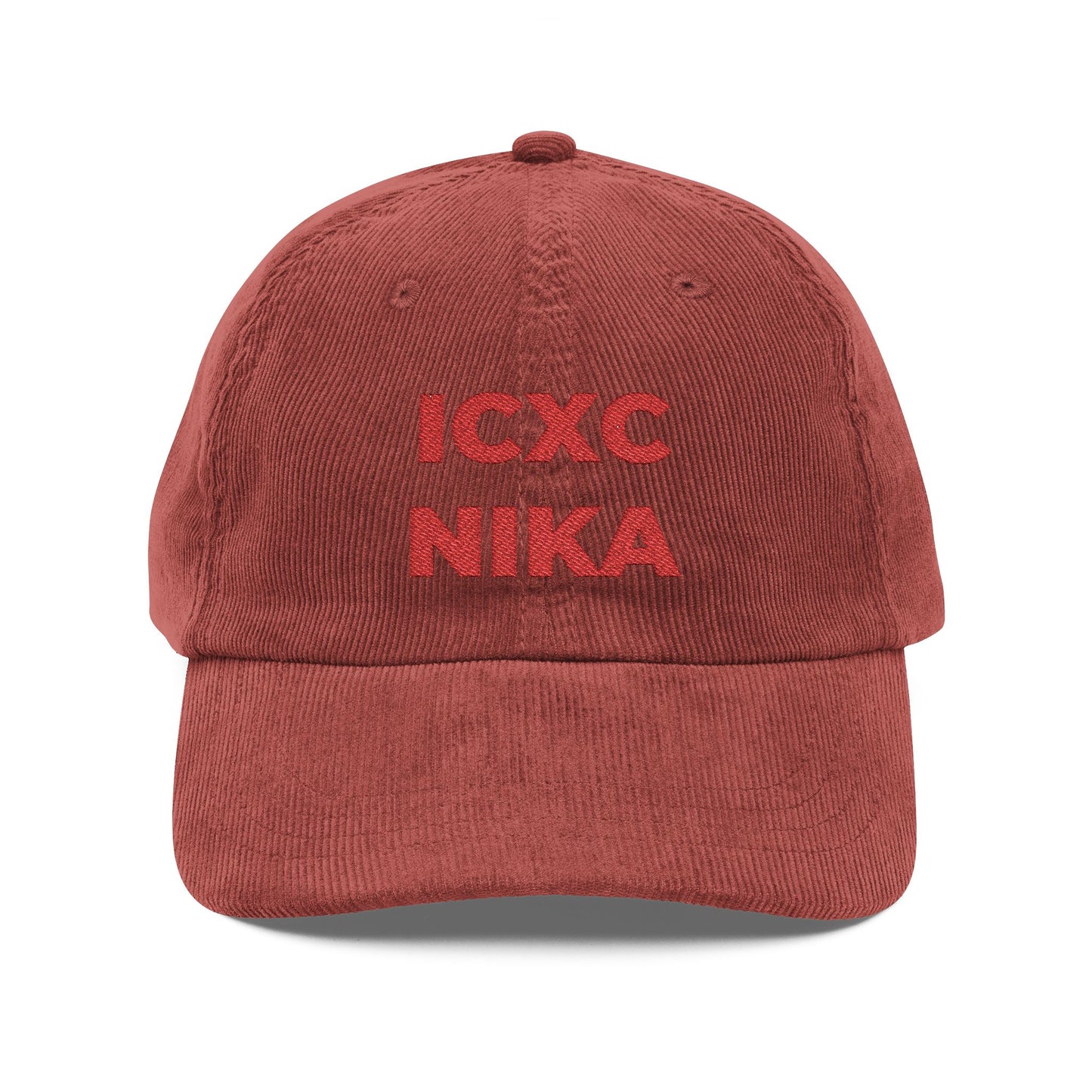 A burgundy cotton corduroy cap featuring the ICXC NIKA Christogram—Orthodox Christian symbol for "Jesus Christ Conquers"—embroidered on the front.