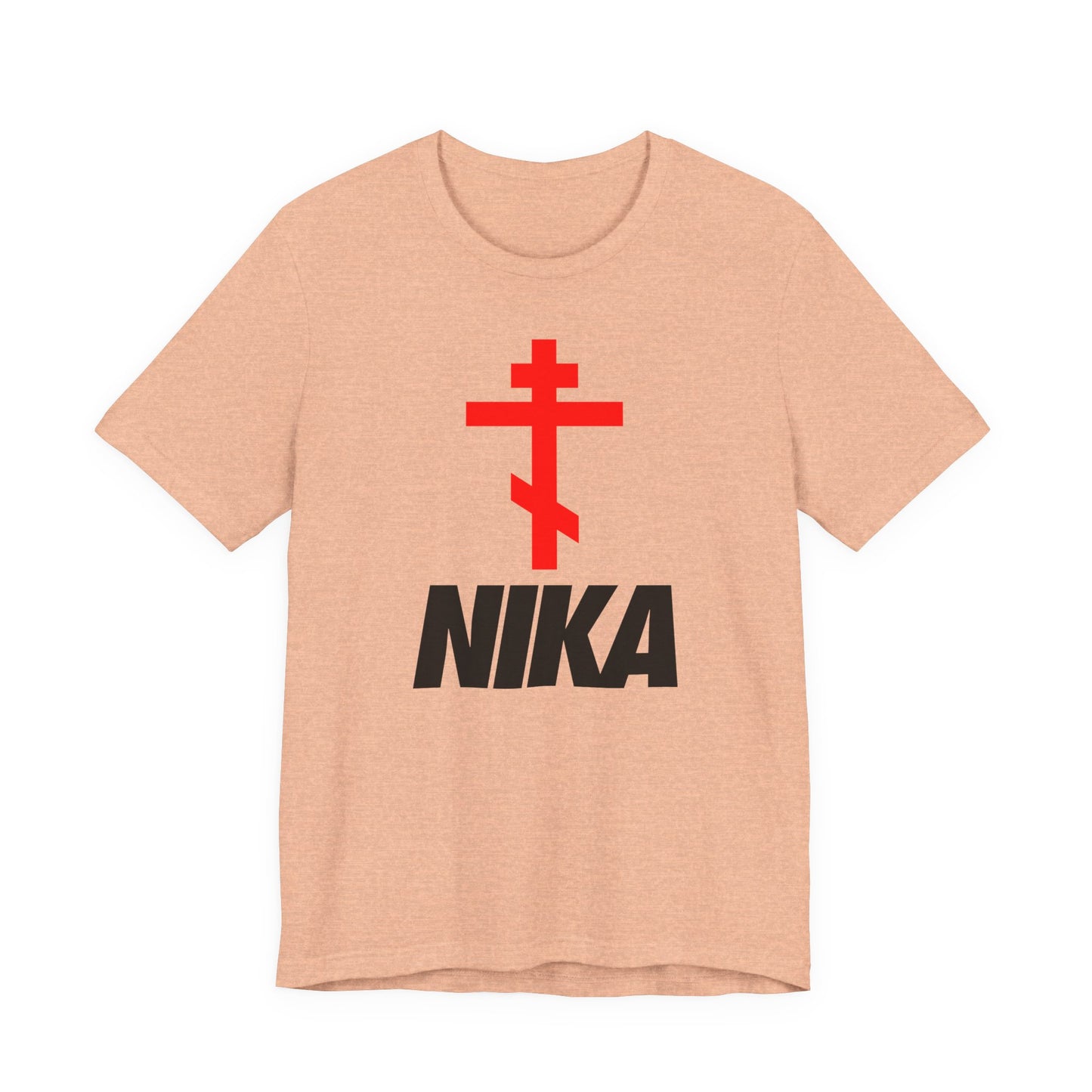 Heather peach t-shirt featuring an Orthodox cross above bold black NIKA text—a minimalist, athletic ascetic design inspired by Jesus Christ Conquers. Christian fashion mashup with a nod to the NIKE logo.