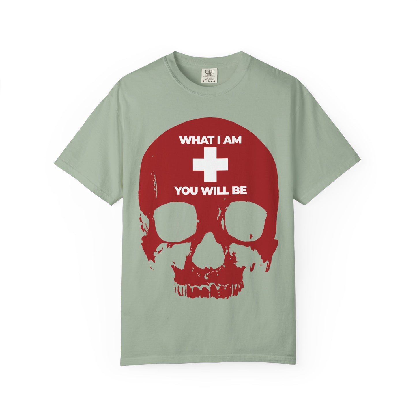 Bay-color heavyweight cotton unisex tee featuring a bold red skull with a white cross and the phrase "WHAT I AM YOU WILL BE," inspired by the wisdom of Ecclesiastes and serving as an Orthodox Christian memento mori—a timeless reminder of life’s impermanence.
