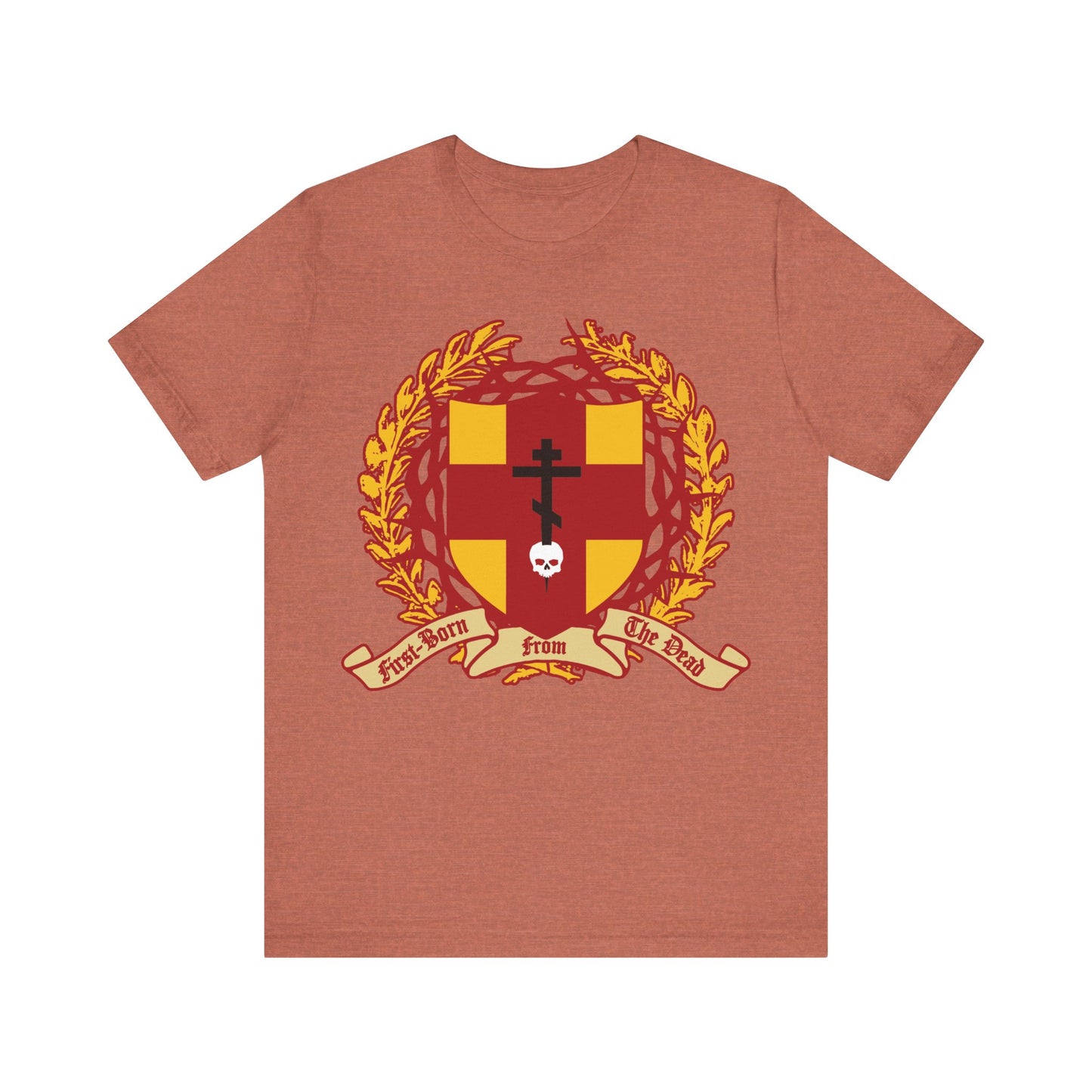 Heather clay unisex tee featuring the Orthodox Cross stabbing a skull, shield with victory wreath and crown of thorns—recalling Christ as "First-Born from the Dead" (Col 1:18) and symbolizing redemption through His sacrifice.