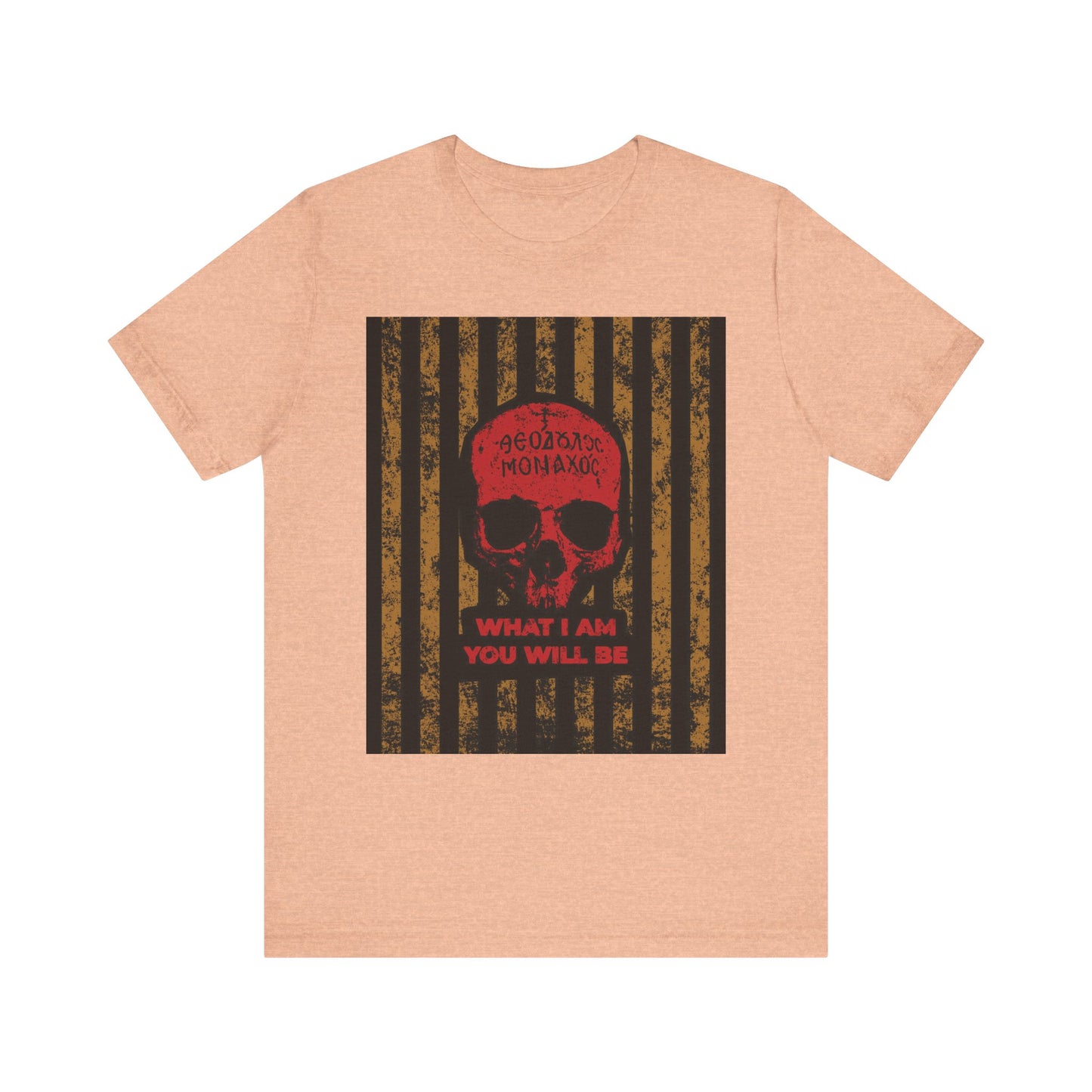 Heather peach unisex t-shirt featuring a Mt Athos monk skull and stripes design with the text "WHAT I AM YOU WILL BE" in red, inspired by the ascetic ethos of memento mori and the remembrance of death often taught by St. Ignatius Brianchaninov.