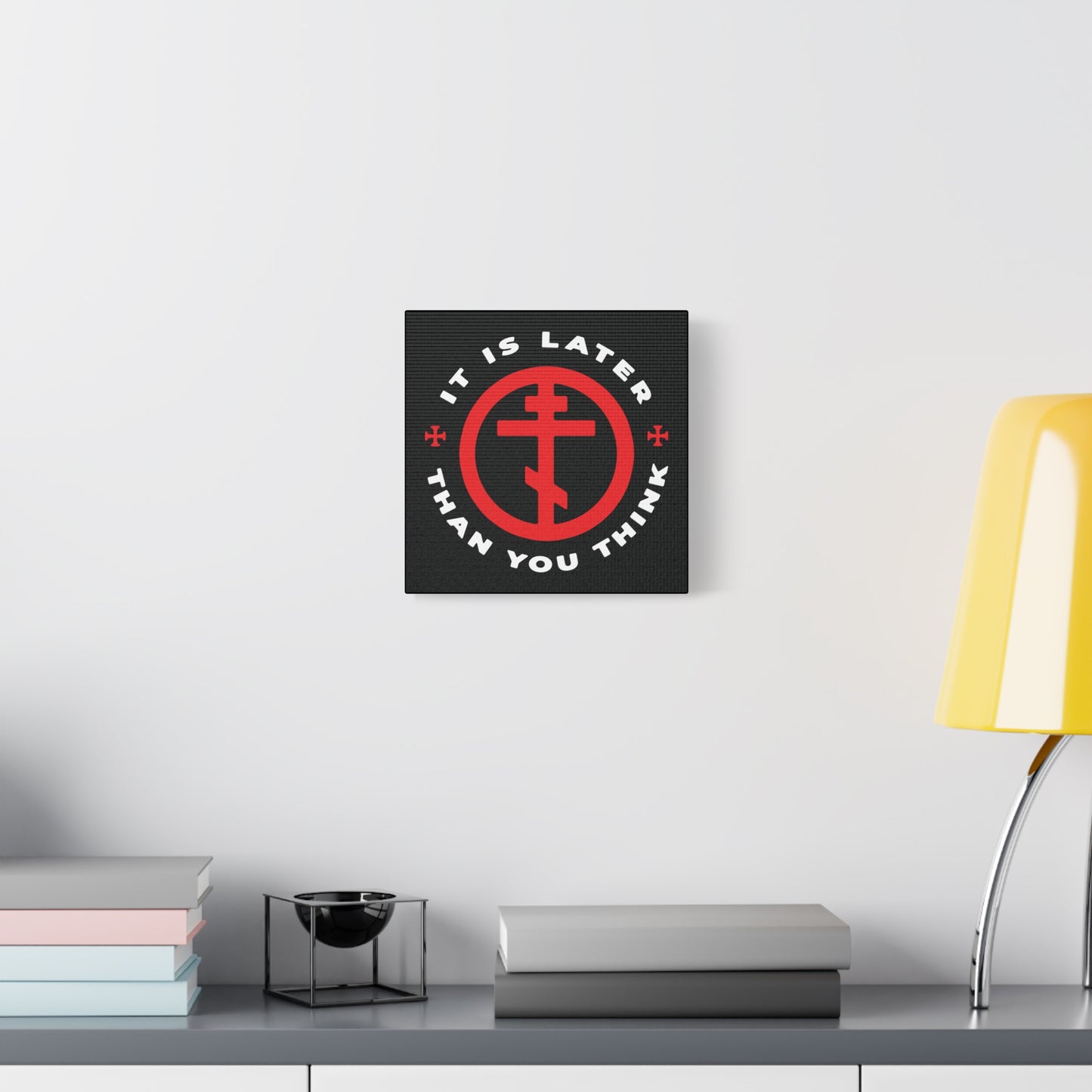 The "It Is Later Than You Think" Christian wall art, featuring an Orthodox cross in a circle and a memento mori message, hangs above a modern desk—a subtle prompt to reflect on faith and time.
