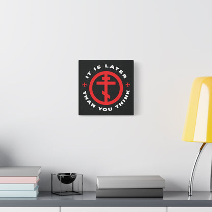 The "It Is Later Than You Think" Christian wall art, featuring an Orthodox cross in a circle and a memento mori message, hangs above a modern desk—a subtle prompt to reflect on faith and time.