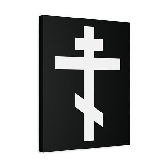 The "White Orthodox Cross" Orthodox Canvas Art features a white cross, symbolizing Christ, centered on a black rectangular canvas set at a slight left angle. Includes Galatians 6:14: "May I never boast, except in the cross of our Lord Jesus Christ.