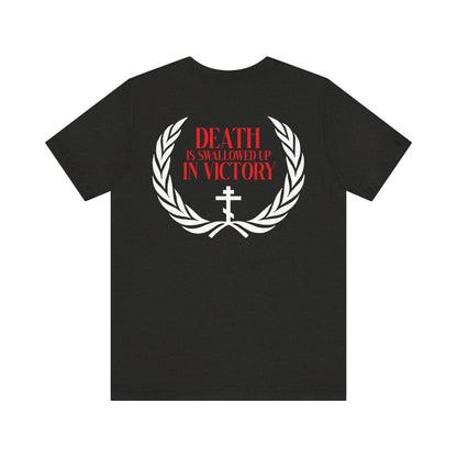The Archangel Michael of the Apocalypse Iconographic / Death is Swallowed Up In Victory t-shirt features white laurel and cross graphics, red text, and references Archangel Michael at Colossae. Double-sided, lightweight cotton unisex fit.