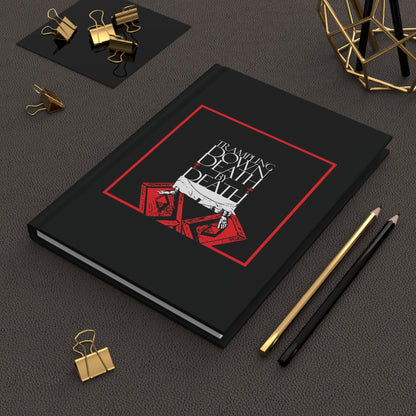 The "Trampling Down Death By Death" Orthodox Christian journal, featuring iconographic Jesus' feet on the Gates of Hades and Pascha themes, is displayed beside pencils, clips, and gold decor on a desk.